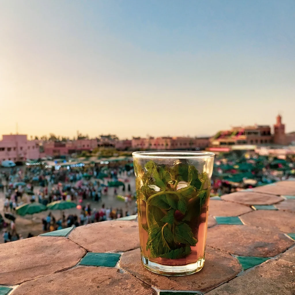 how many days in marrakech glass-of-mint-tea-on-stone-tiles-in-background-of-jamae-el-fna